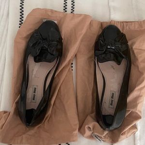 MIU MIU Iconic patent leather loafers with rhinestone heel